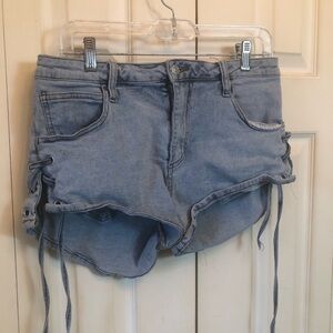 AKIRA Light Wash Denim Lace-Up Side Shorts